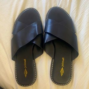 Flat slide on black criss-cross shoes